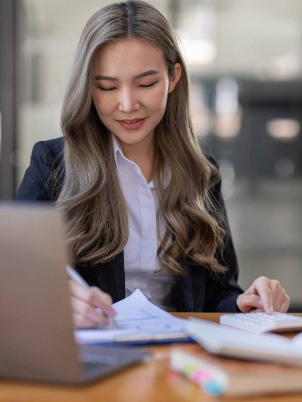 business-asian-woman-or-accountant-bookkeeper-working-on-calculator-to-calculate-business-data-1-1.jpg