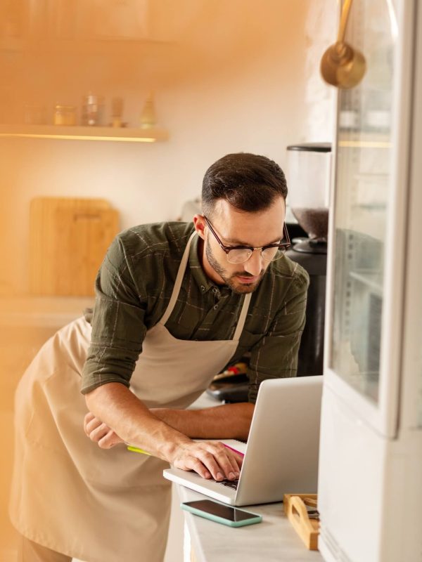 businessman-doing-bookkeeping-while-owning-coffee-shop.jpg